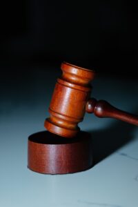 Judge's gavel with dark blue background