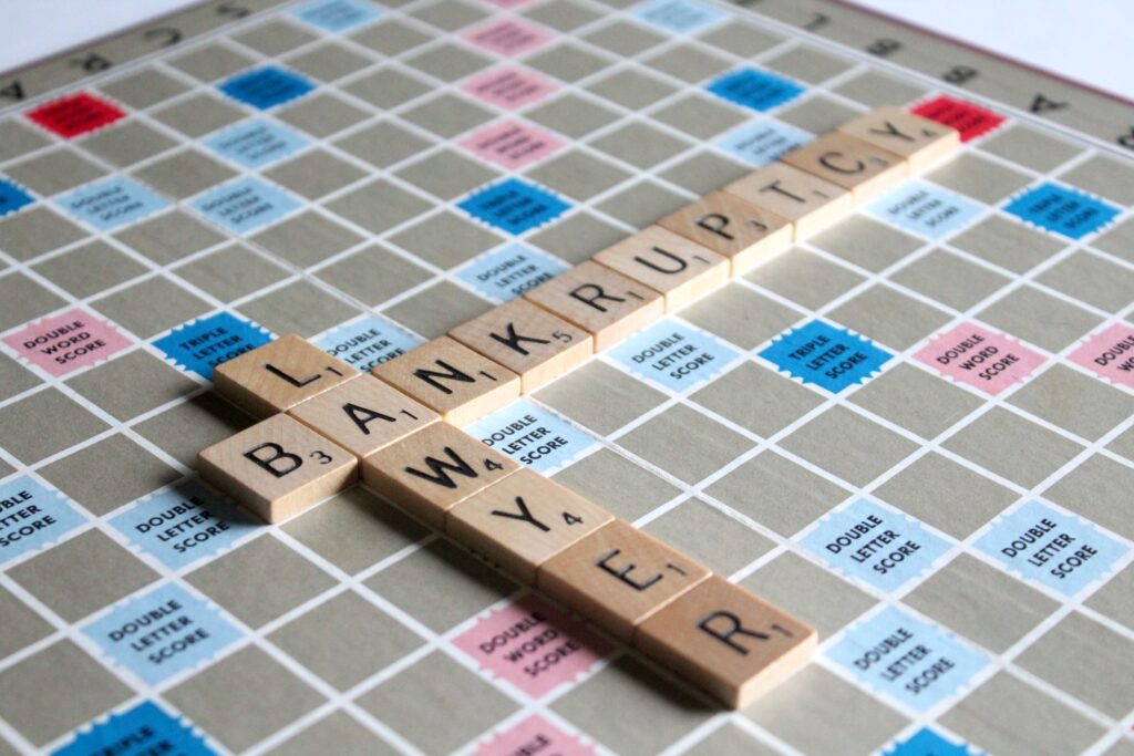 Scrabble Board with time letters that spell bankruptcy lawyer