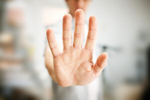 Picture of a man's hand up and put front indication "Stop"!